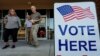 Para pemilih meninggalkan pusat pemilihan saat pemungutan suara pendahuluan, Selasa, 21 Mei 2024, di Kennesaw, Ga. (AP/Mike Stewart)