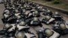 ILUSTRASi - Perlengkapan polisi anti huru hara diletakkan di tanah saat aksi protes masyarakat terhadap hasil pemilihan presiden baru-baru ini di Jakarta, 22 April 2024. (Yasuyoshi CHIBA / AFP)