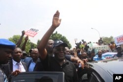 Atiku Abubakar of the People's Democratic Party and second-place candidate, greets his supporters during a protest against the recent presidential election results, in Abuja, Nigeria, March 6, 2023.