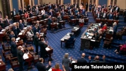 In this image from video from Senate Television, Sen. Patty Murray, D-Wash., swears senators in for the impeachment trial of Homeland Security Secretary Alejandro Mayorkas on the Senate floor at the U.S. Capitol, April 17, 2024, in Washington.