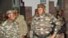 FILE - General Abdourahmane Tiani, who was declared as the new head of state of Niger by leaders of a coup, arrives to meet with ministers in Niamey, Niger July 28, 2023. 