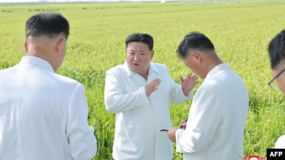 This undated picture released from North Korea's official Korean Central News Agency (KCNA) on Aug. 18, 2023, shows North Korea's leader Kim Jong Un, center, inspecting restoration activities at a farm in Anbyon-gun, Kangwon province, which was recently damaged by a typhoon.