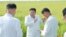 This undated picture released from North Korea's official Korean Central News Agency (KCNA) on Aug. 18, 2023, shows North Korea's leader Kim Jong Un, center, inspecting restoration activities at a farm in Anbyon-gun, Kangwon province, which was recently damaged by a typhoon.