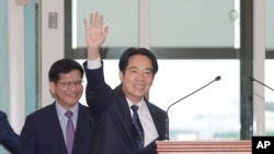 Taiwanese Vice President William Lai waves to the media as he departs for Paraguay in Taoyuan, Taiwan on Aug. 12, 2023.