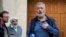 FILE - Nobel Peace Prize laureate Dmitry Muratov, editor-in-chief of the influential Russian newspaper Novaya Gazeta speaks to journalists outside a court in Moscow, Russia, June 8, 2023.