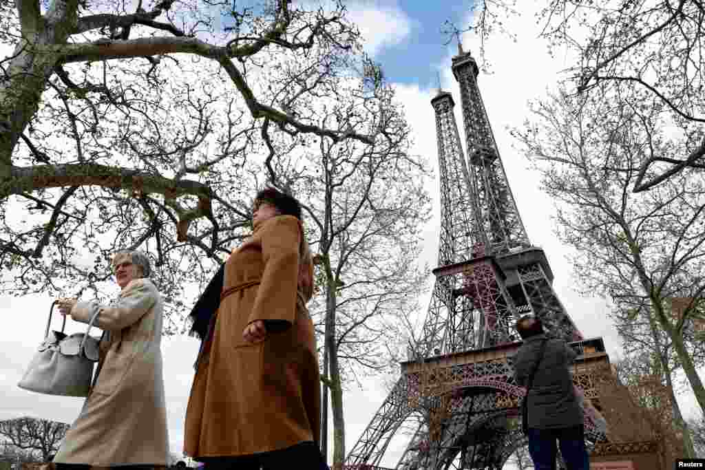 "Eiffela," a replica of the famous Parisian Tower, 10 times smaller than its model and created by Philippe Maindron, is pictured near the original one in Paris, France.