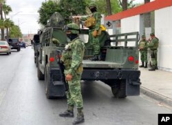 Mexican army soldiers prepare a search mission for four U.S. citizens kidnapped by gunmen in Matamoros, Mexico, March 6, 2023.