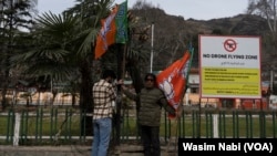 The local Bharatiya Janata Party installs party flags at several locations in Srinagar on March 6, 2024, to welcome the prime minister, Narendra Modi, who is scheduled to visit the Indian side of Kashmir on March 7, 2024.