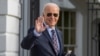 FILE — U.S. President Joe Biden waves as he walks to Marine One to depart the South Lawn of the White House in Washington, Dec. 5, 2023. 