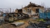 FILE - The village of Pravdne, Ukraine, is strewn with debris and broken Russian tanks after it was retaken by Ukraine in November in this picture from Jan. 26, 2023.