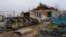 FILE - The village of Pravdne, Ukraine, is strewn with debris and broken Russian tanks after it was retaken by Ukraine in November in this picture from Jan. 26, 2023.