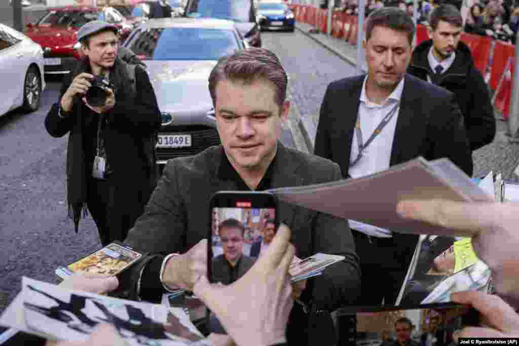 Matt Damon signs autographs upon arrival for the photo call for the film &#39;Kiss The Future&#39; during the International Film Festival &#39;Berlinale&#39;, in Berlin, Germany.