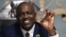 Botswana's President Mokgweetsi Masisi holds a large diamond discovered in his country, at his office in Gaborone, Aug. 22, 2024.