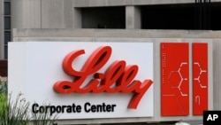 FILE - A sign for Eli Lilly & Co. sits outside their corporate headquarters in Indianapolis on April 26, 2017.