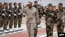 FILE - Moroccan and AFRICOM commanders review an honor guard during an exercise in Morocco, May 31, 2024. AFRICOM’s deputy legal counsel, retired Col. Max Maxwell, says it is critical to ensure the rule of law is followed when troops are deployed.