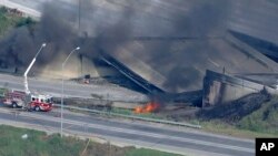 This screen grab from video provided by WPVI-TV/6ABC shows the collapsed section of I-95 with fire trucks on the scene in Philadelphia, June 11, 2023.