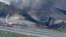 This screen grab from video provided by WPVI-TV/6ABC shows the collapsed section of I-95 with fire trucks on the scene in Philadelphia, June 11, 2023.