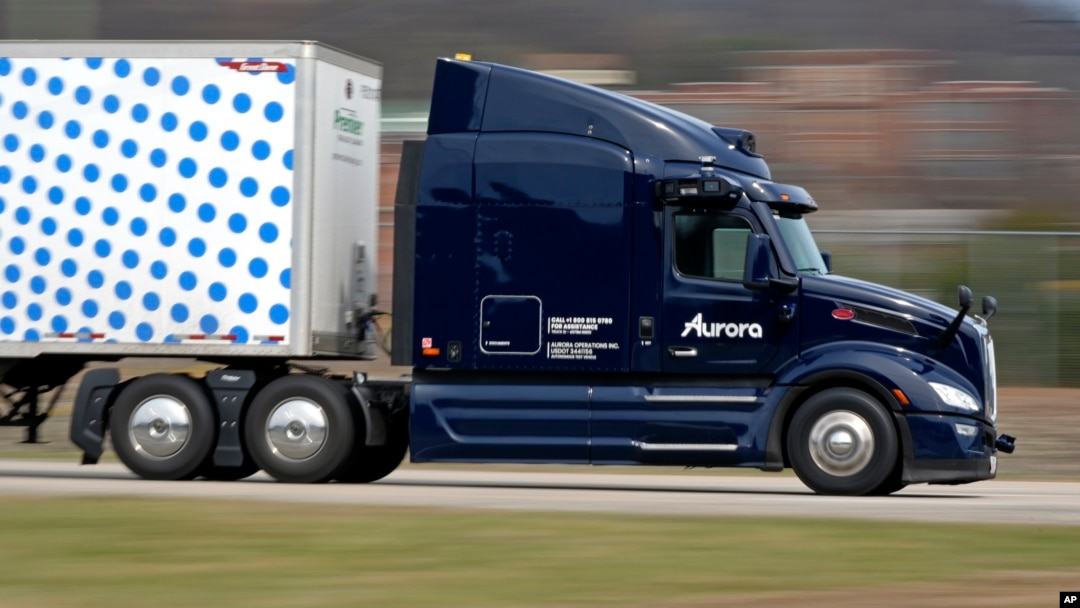 A self-driving tractor-trailer maneuvers around a test track in Pittsburgh, Thursday, March 14, 2024. (AP Photo/Gene J. Puskar)