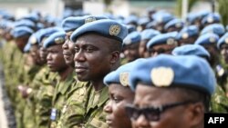FILE - Members of the U.N. Multidimensional Integrated Stabilization Mission in Mali (MINUSMA) stand during a ceremony at Camp Gallieni in Abidjan, Jan. 24, 2023.