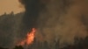 FILE — Trees catch fire during the Eagle Bluff wildfire in Osoyoos, British Columbia, Canada, July 30, 2023. 