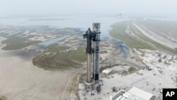 This undated photo provided by SpaceX shows the company's Starship rocket at the launch site in Boca Chica, Texas.