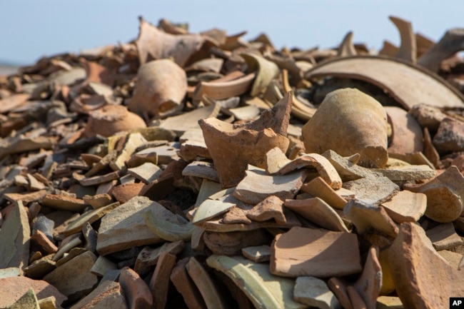 Shards of pottery are seen at the site of a 5,000-year-old ancient city-state of Lagash, near Nasiriyah, Iraq, Thursday, Feb. 23, 2023.