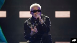 FILE - Chinese rapper Boss X performs at a concert in Chengdu in southwestern China's Sichuan province, March 16, 2024.