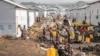 FILE - People displaced by fighting between Congolese forces and M23 rebels gather in a camp on the outskirts of Goma, Democratic Republic of the Congo, March 13, 2024. Fighting in part of eastern Democratic Republic of Congo has displaced over 100,000 people in the last week.