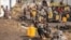 FILE - People displaced by fighting between Congolese forces and M23 rebels gather in a camp on the outskirts of Goma, Democratic Republic of the Congo, March 13, 2024.