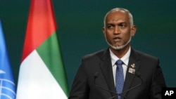 FILE - Maldives President Mohamed Muizzu speaks at the COP28 U.N. Climate Summit in Dubai, United Arab Emirates, Dec. 1, 2023. The Maldives and India are locked in a dispute as New Delhi considers the Indian Ocean archipelago to be within its sphere of influence.