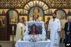 FILE - A memorial mass for slain Al Jazeera correspondent Shireen Abu Akleh is held at a church ahead of the first anniversary of her death, in the east Jerusalem neighborhood of Beit Hanina, May 7, 2023.