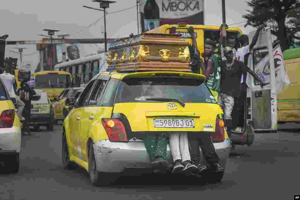 A taxi carrying a casket navigates through heavy traffic following the departure of Pope Francis from Kinshasa, Democratic Republic of Congo, Friday February 3, 2023. Francis was in the DRC and South Sudan for a six-day trip, hoping to bring comfort and encouragement to two countries that have been riven by poverty, conflicts and what he calls a &quot;colonialist mentality&quot; that has exploited Africa for centuries.&nbsp;