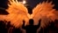 A reveler is silhouetted against a pair of angel wings as they help a performer with a costume during a Gay Pride parade marking the culmination of LGBTQ+ Pride month, in Asuncion, Paraguay, June 29, 2024. 