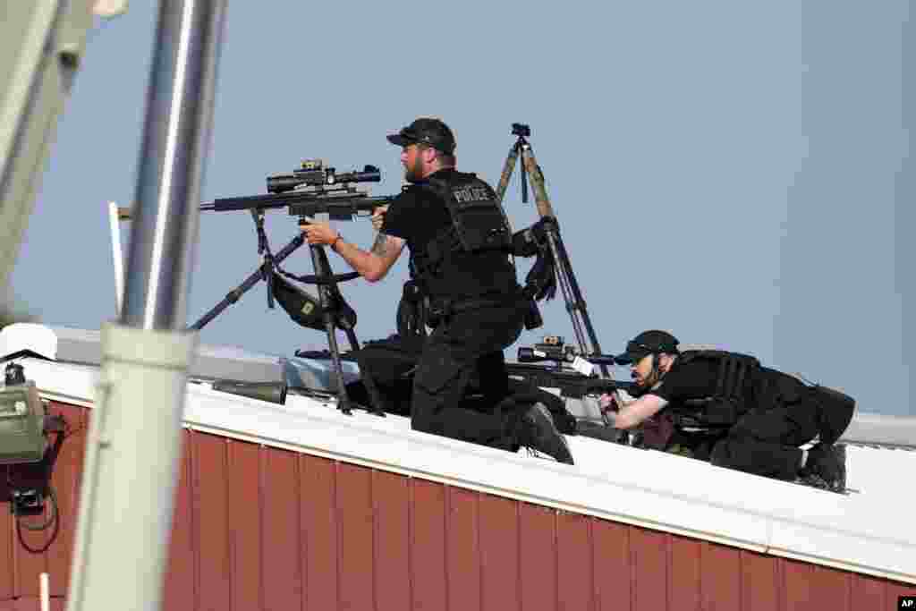 Police snipers return fire after shots were fired while Donald Trump was speaking.