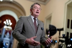 FILE - Rep. Thomas Massie, R-Ky., speaks at the Capitol in Washington, Jan. 12, 2024. Massie, who backed Ron DeSantis’ presidential bid, is facing a challenge in the 4th District Republican primary from Eric Deters, a staunch Donald Trump supporter.