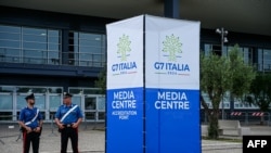Police officers stand outside the G7 Italy 2024 media center in Bari, Italy, on June 11, 2024. 