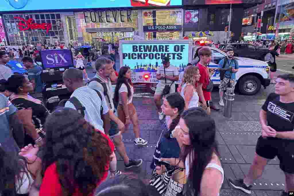 An electronic billboard on an NYPD vehicle notifies visitors to Beware of Pickpockets in Times Square in New York, July 21, 2024.