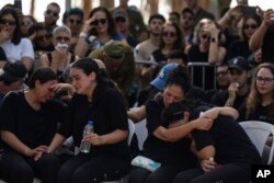 Mourners attend the funeral of Erik Kraunik, the chief of security of Kibbutz Be'eri, at Yehud cemetery, central Israel, Oct. 23, 2023. Kraunik was killed by Hamas militants at Kibbutz Be'eri near the border with the Gaza Strip.