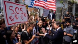 U.S. Secretary of State Antony Blinken speaks to families and supporters of Israeli hostages held by Hamas in Gaza during a protest calling for their return, after meeting families of hostages in Tel Aviv, May 1, 2024. 