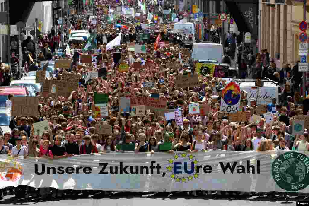 Protesters hold a banner that reads "Our future, your vote," as Fridays for Future demonstrates for a social and climate-friendly Europe, in Berlin, Germany.