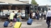 This handout photograph taken and released by the Government of Kursk region of Russia on Aug. 9, 2024, shows women and children being evacuated from the town of Rylsk in Kursk region. 