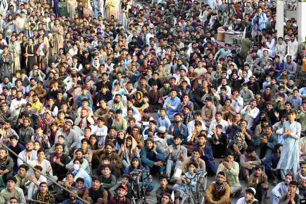 Afghan cricket fans watch the men&#39;s T20 World Cup semi final cricket match between Afghanistan and South Africa, on a big screen in the city of Jalalabad, east of Afghanistan. (AP Photo/Shafiullah Kakar)