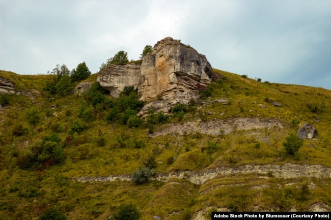 FILE - The Rocky hills of Bakota Bay in the old village were flooded after a big hydroelectricity dam was built on the Dniester River. Khmelnytskyi region, Ukraine. (Adobe Stock Photo by Blumesser)