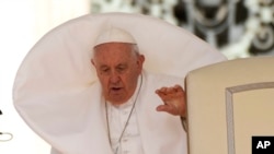 FILE: Pope Francis arrives for his weekly general audience in St. Peter's Square at The Vatican, Wednesday, May 3, 2023. 