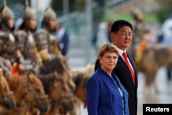 Swiss President Viola Amherd and Mongolian President Ukhnaa Khurelsukh attend a welcome ceremony on Sukhbaatar Square in Ulaanbaatar, Mongolia, Aug. 2, 2024.