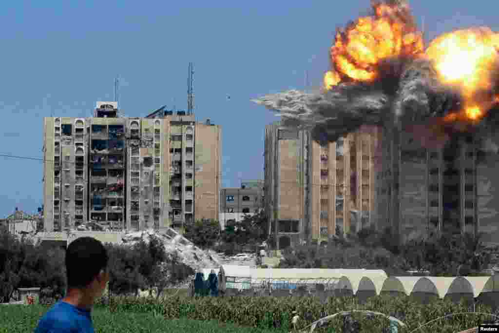 An explosion occurs following an Israeli airstrike on a residential building, amid the Israel-Hamas conflict, in Nuseirat in the central Gaza Strip, July 20, 2024.