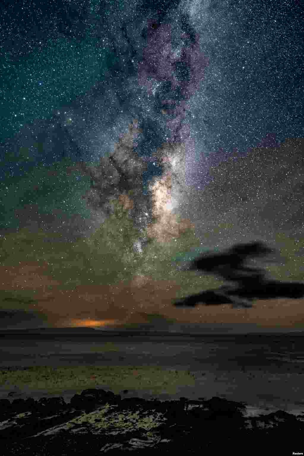 A view shows the Milky Way in a starry sky, in Punta del Arbol, Chile, May 11, 2024. 