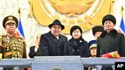 In this photo provided by the North Korean government, Kim Jong Un, center left, and his daughter attend a military parade to mark the 75th founding anniversary of the Korean People’s Army on Kim Il Sung Square in Pyongyang, North Korea, Feb. 8, 2023.