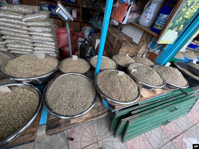 Several types of coffee beans are laid out for sale at Sholla Market, an outdoor flea market, in Addis Ababa, Ethiopia on Wednesday, Aug. 16, 2023. (AP Photo/Almaz Abedje)