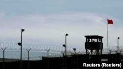FILE: A guard tower of Camp Delta is seen at the Guantanamo Bay Naval Station in Guantanamo Bay, Cuba. Taken Sept. 4, 2007
